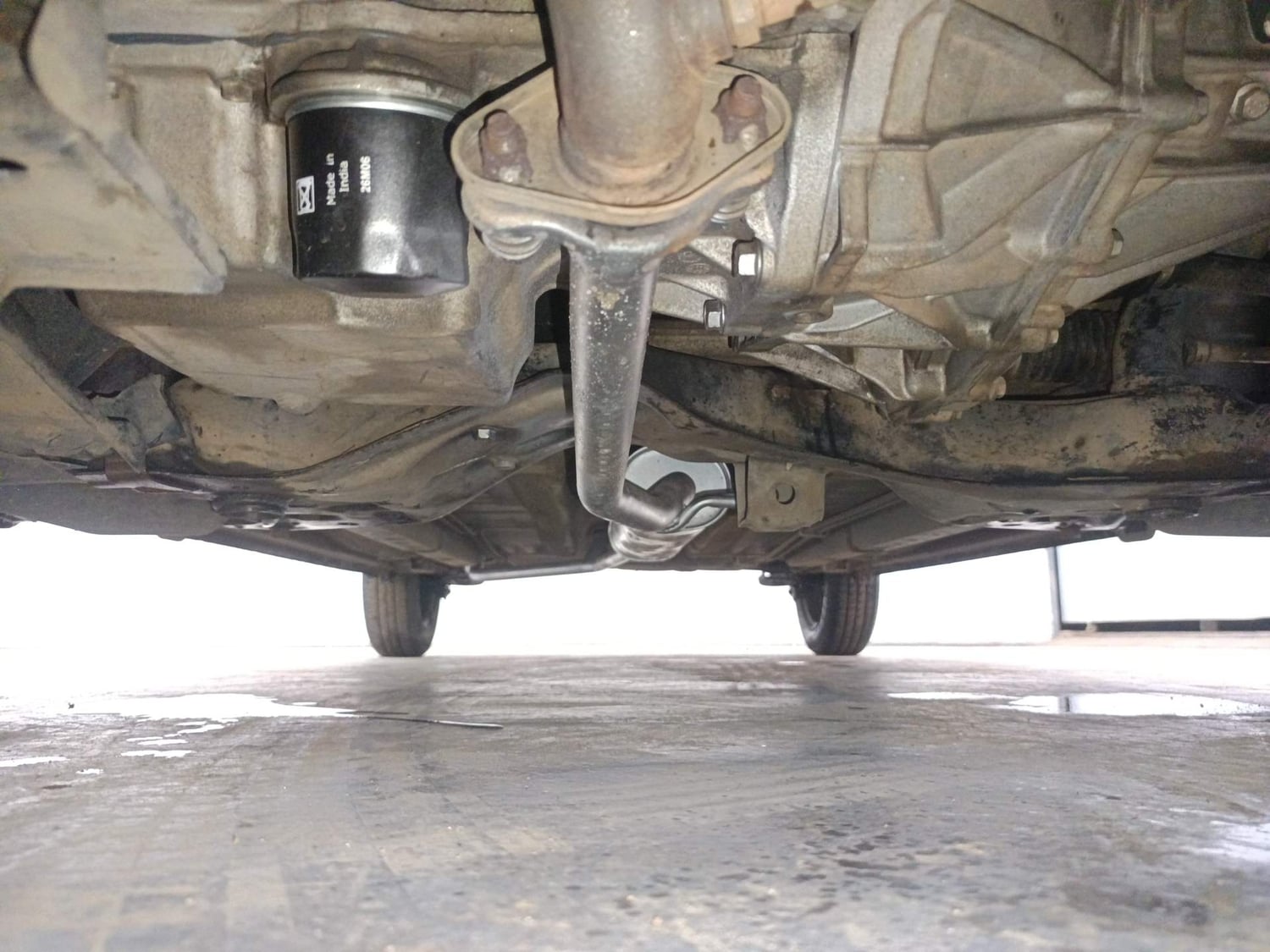 Used 2014 Maruti Suzuki Celerio VXi AMT Petrol Automatic extra FRONT LEFT UNDERBODY VIEW