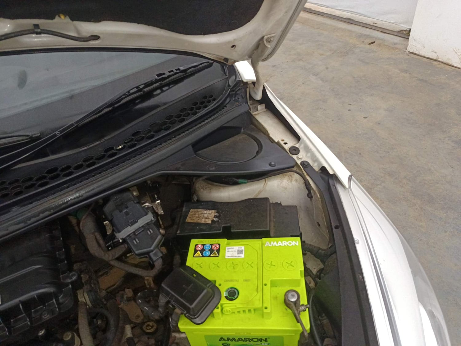 Used 2016 Tata Tiago Revotron XT Petrol Manual engine ENGINE LEFT SIDE HINGE & APRON VIEW