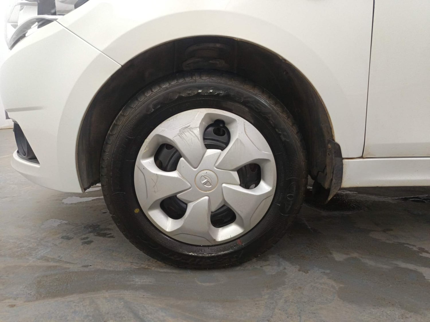 Used 2016 Tata Tiago Revotron XT Petrol Manual tyres LEFT FRONT TYRE RIM VIEW