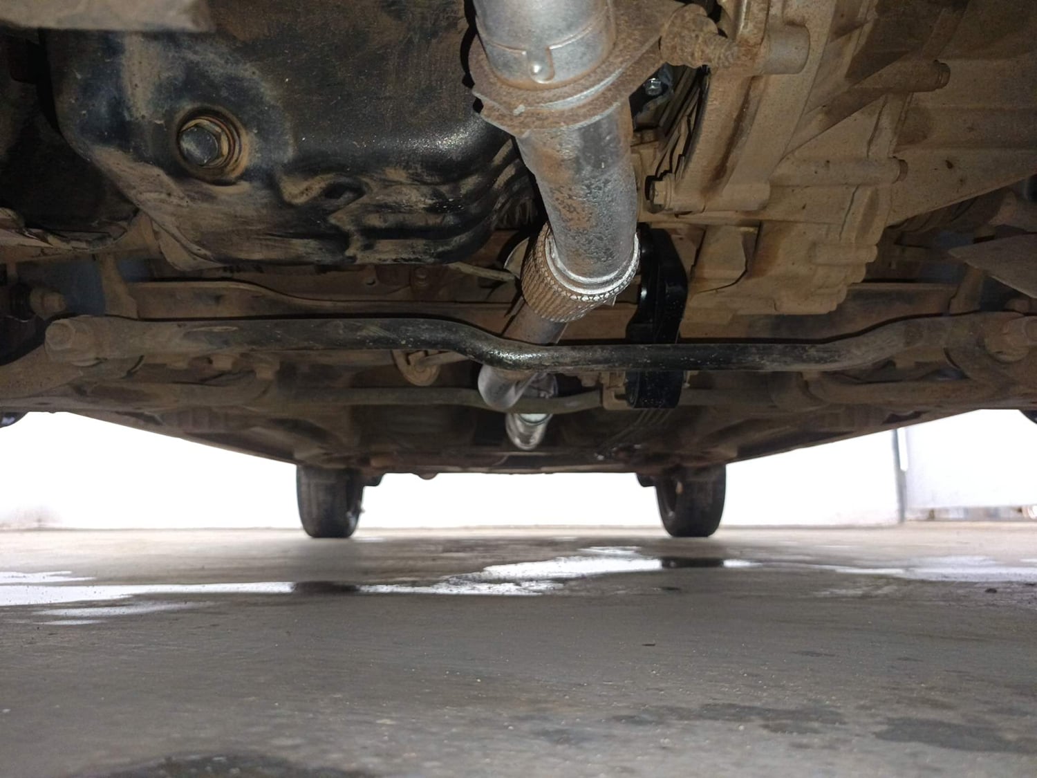 Used 2016 Tata Tiago Revotron XT Petrol Manual extra FRONT LEFT UNDERBODY VIEW