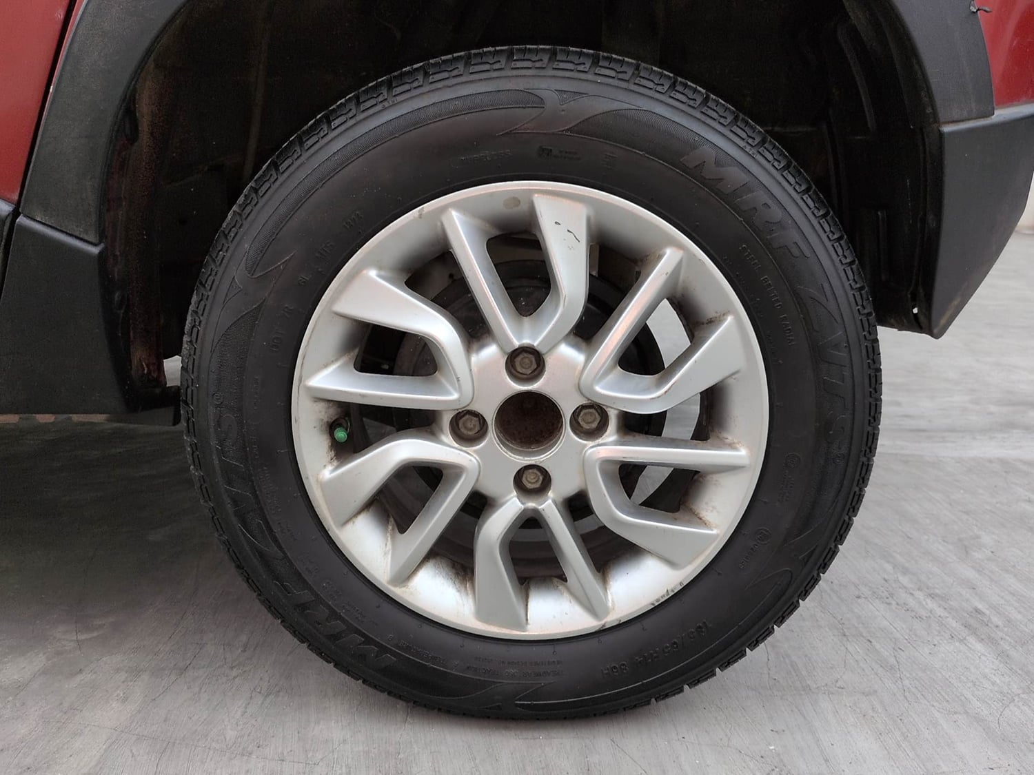 Used 2017 Mahindra KUV100 K6 6 STR Petrol Manual tyres LEFT REAR TYRE RIM VIEW