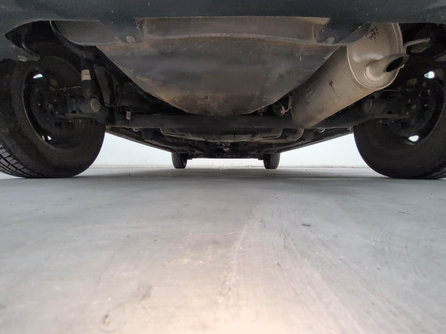 Used 2024 Tata Tiago XE Petrol Manual extra REAR UNDERBODY VIEW (TAKEN FROM REAR)