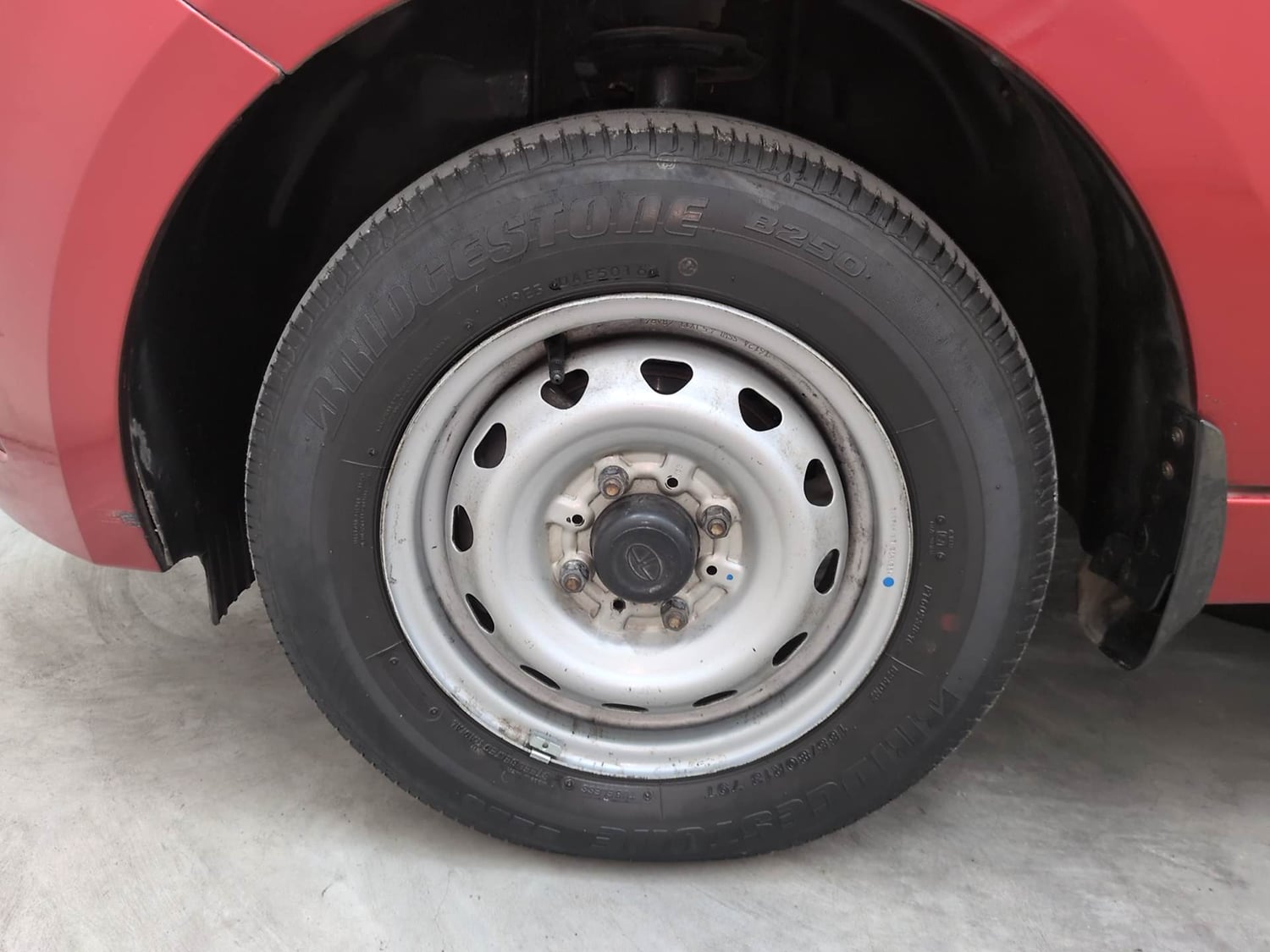 Used 2017 Tata Tiago Revotron XE Petrol Manual tyres LEFT FRONT TYRE RIM VIEW