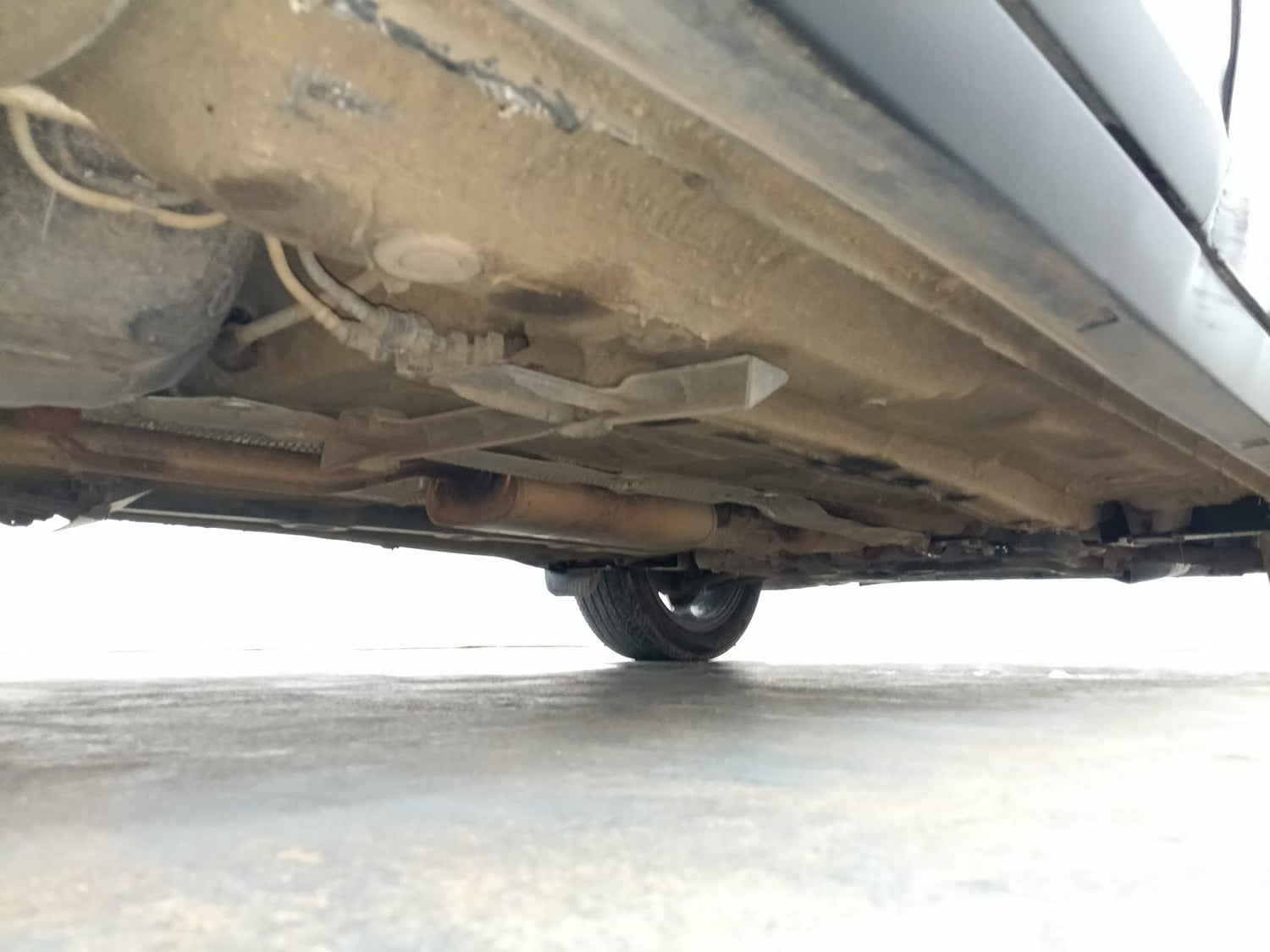 Used 2024 Volkswagen Taigun Topline 1.0 TSI AT Petrol Automatic extra REAR RIGHT UNDERBODY VIEW