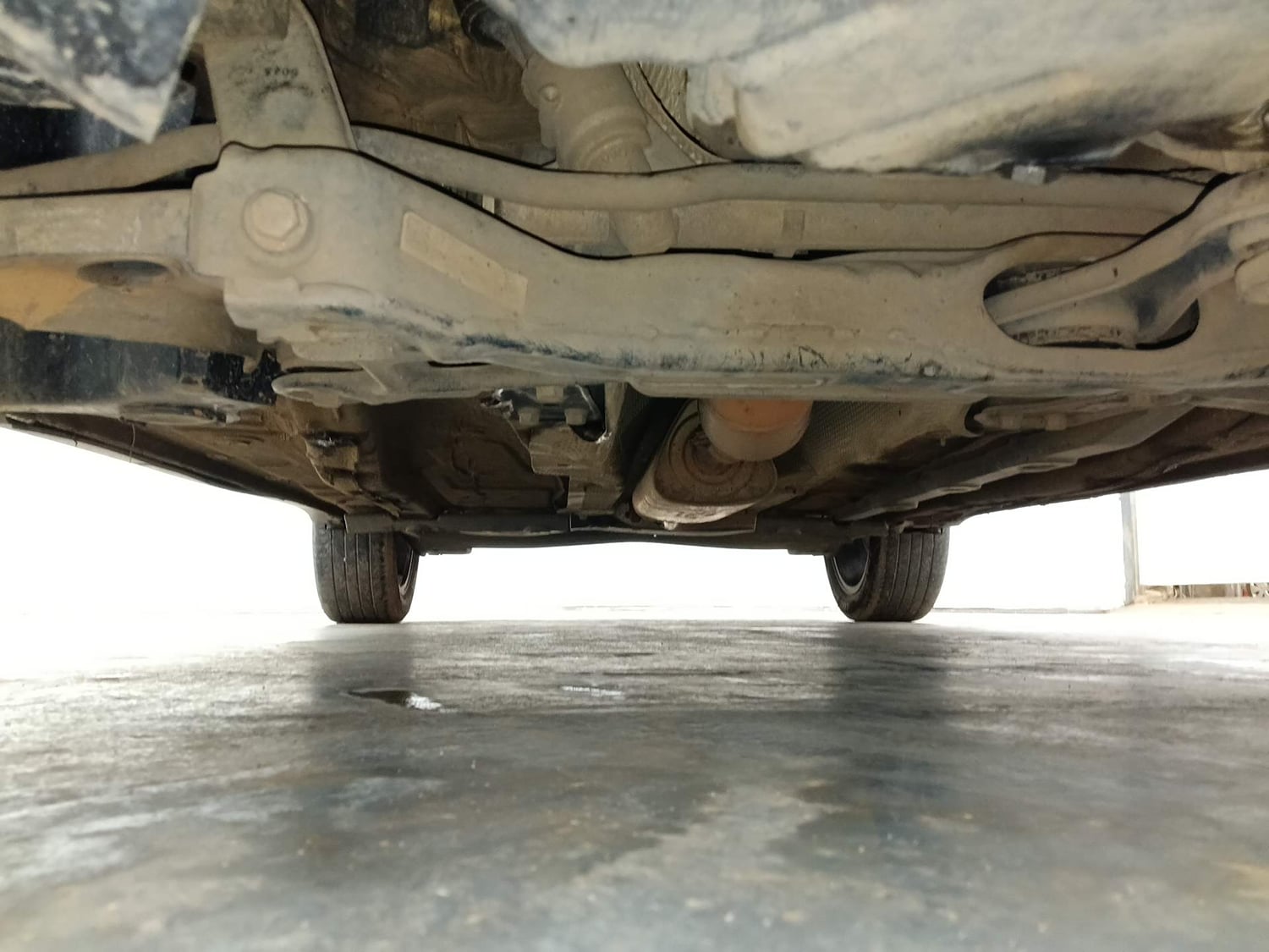 Used 2024 Volkswagen Taigun Topline 1.0 TSI AT Petrol Automatic extra FRONT LEFT UNDERBODY VIEW