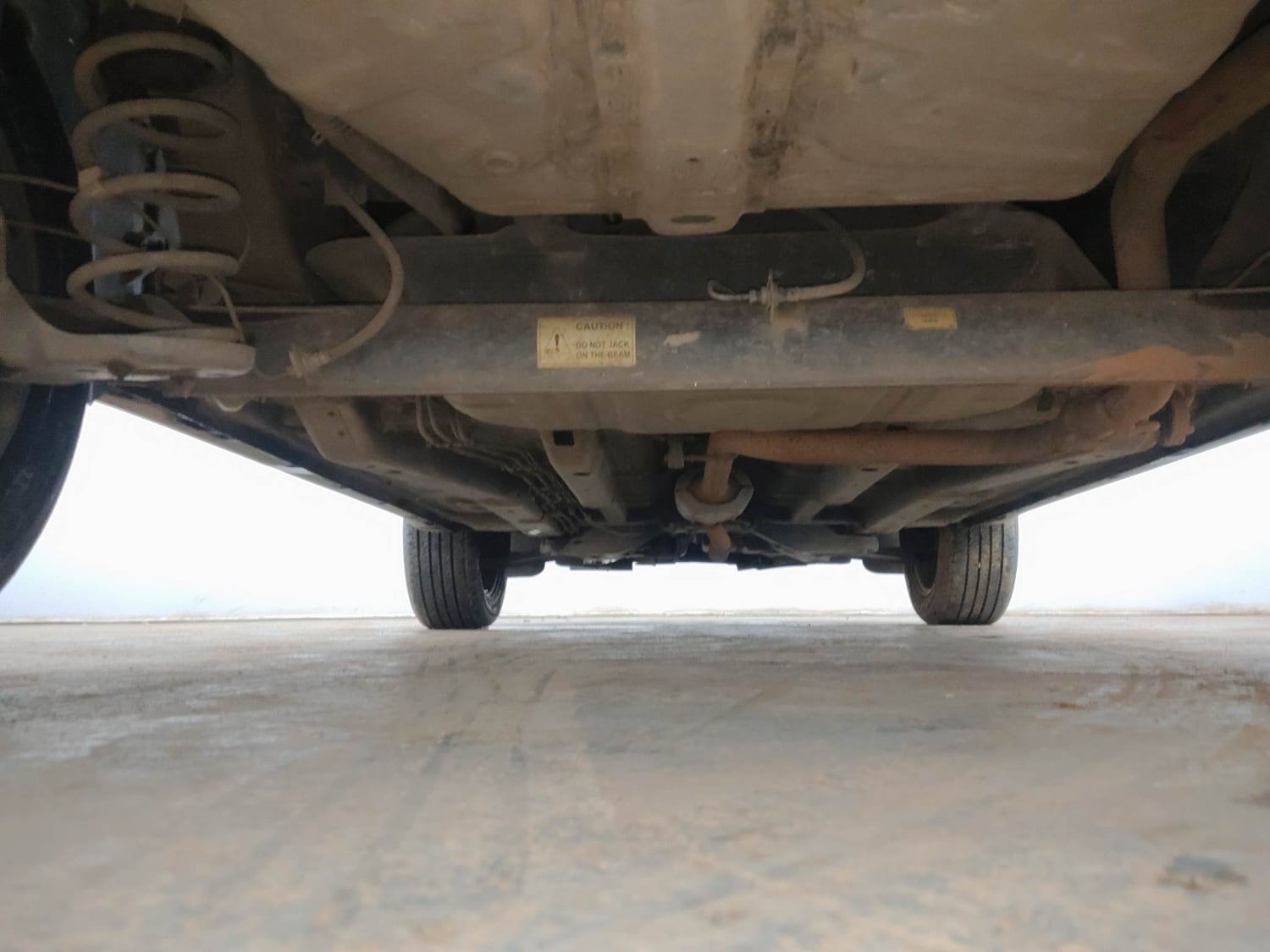 Used 2024 Tata Nexon Fearless Plus S Purple 1.5 Revotorq Diesel 6AMT Dual Tone Diesel Automatic extra REAR UNDERBODY VIEW (TAKEN FROM REAR)