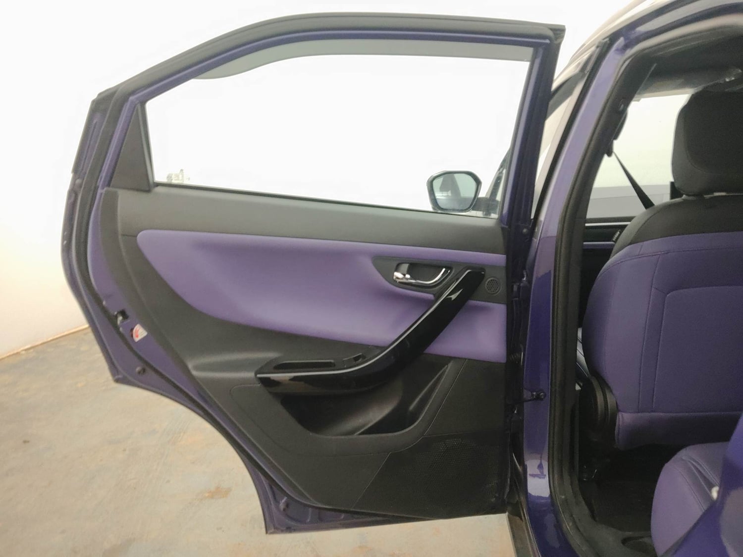 Used 2024 Tata Nexon Fearless Plus S Purple 1.5 Revotorq Diesel 6AMT Dual Tone Diesel Automatic interior LEFT REAR DOOR OPEN VIEW
