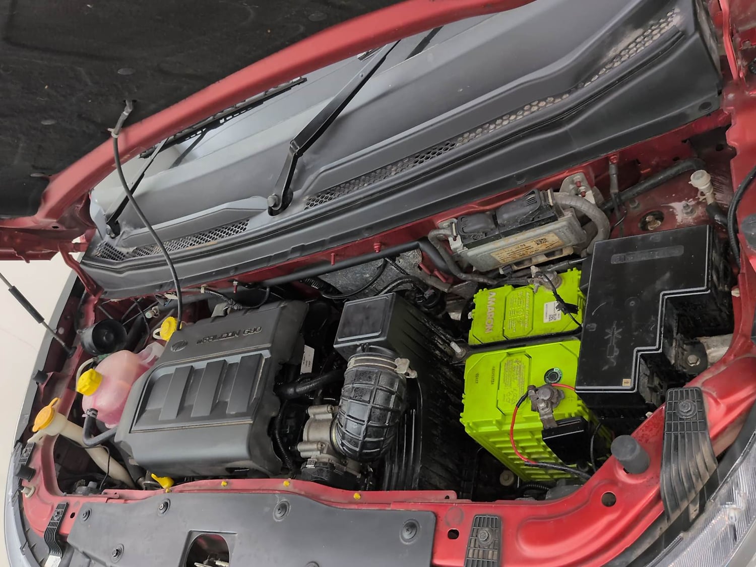 Used 2017 Mahindra KUV100 K8 6 STR Dual Tone Petrol Manual engine ENGINE LEFT SIDE VIEW